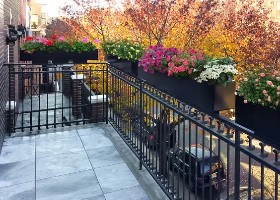corten steel planters on a balcony railing